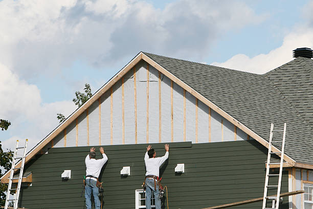 Professional Storm Damage Siding Repair technician working in Lyndora, PA